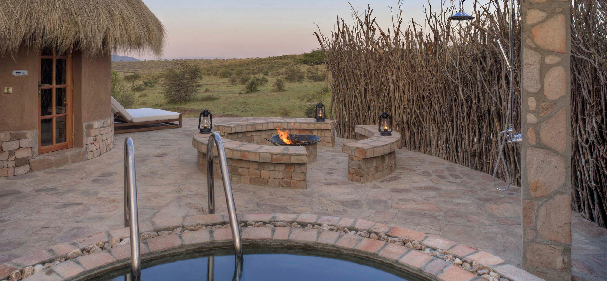 Fire pit burning beside the plunge pool