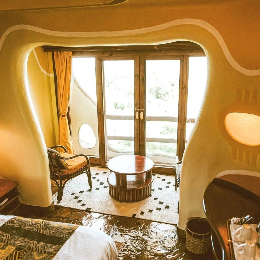 Balcony seating in the Standard King Room at Mara Serena Safari Lodge, styled with the essence of unique resorts