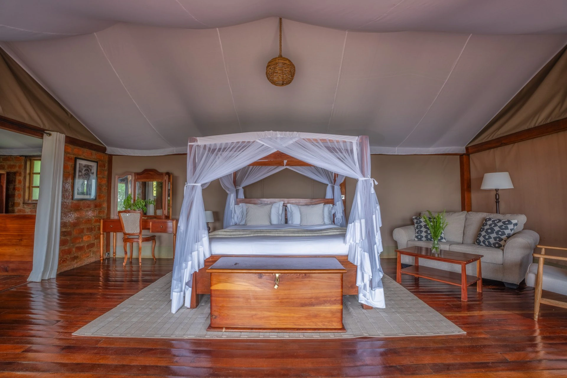 Family Chalet king bedroom with four-poster mosquito net bed